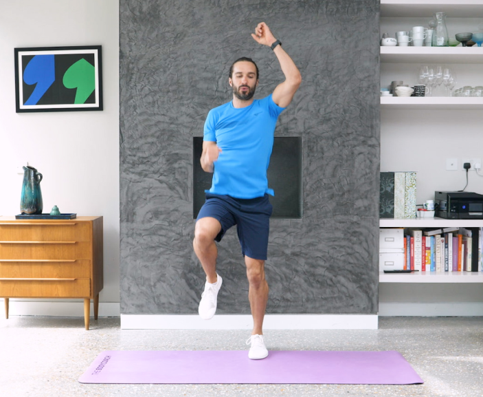 Joe Wicks doing exercises in his living room